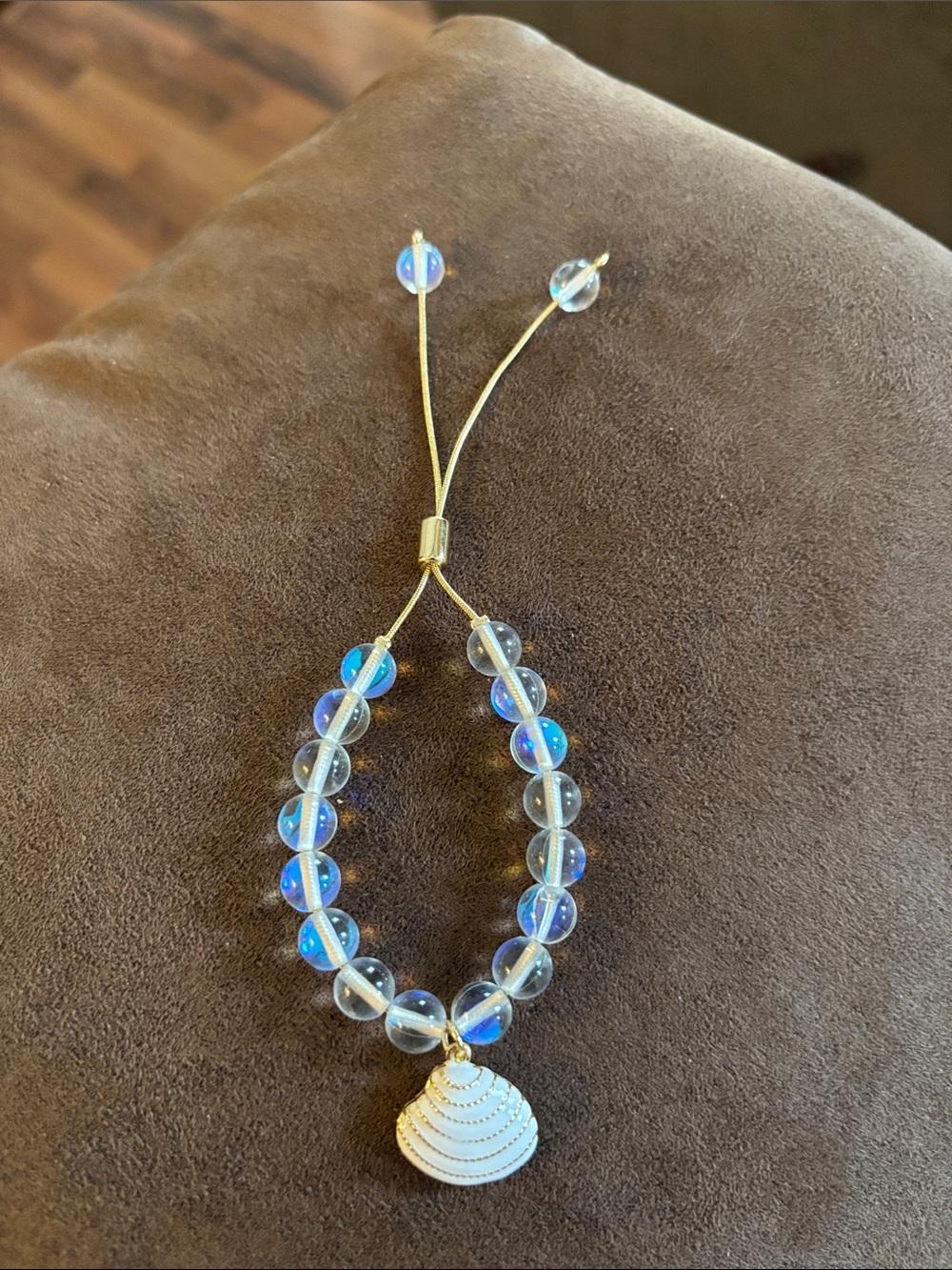 Adjustable Gold Strand Bracelet with Iridescent clear beads and white shell